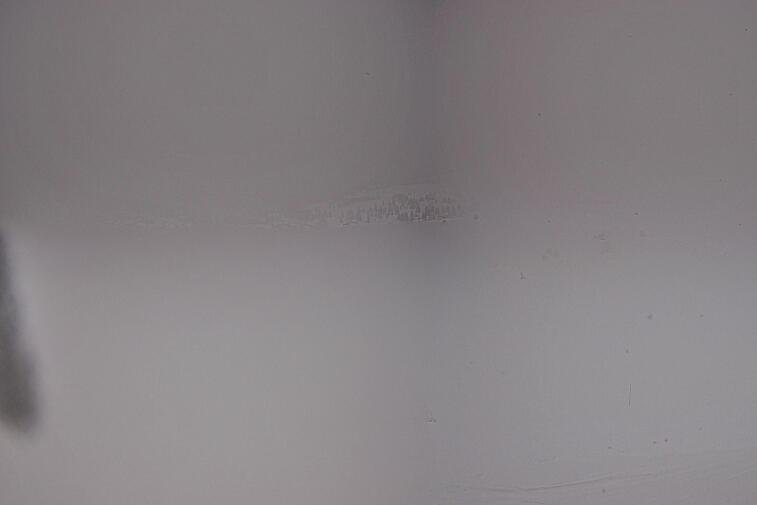 Birds-eye webcam view of conditions on the pistes above Courchevel 1650. The top station of the Ariondaz cable car is visible on the left-hand side of the shot.