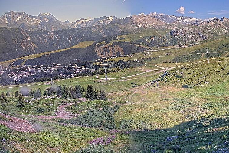 Birds-eye webcam view of conditions on the pistes above Courchevel 1650. The top station of the Ariondaz cable car is visible on the left-hand side of the shot.