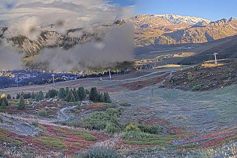 Birds-eye webcam view of conditions on the pistes above Courchevel 1650. The top station of the Ariondaz cable car is visible on the left-hand side of the shot.