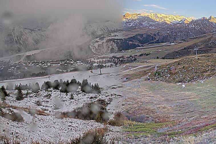 Birds-eye webcam view of conditions on the pistes above Courchevel 1650. The top station of the Ariondaz cable car is visible on the left-hand side of the shot.