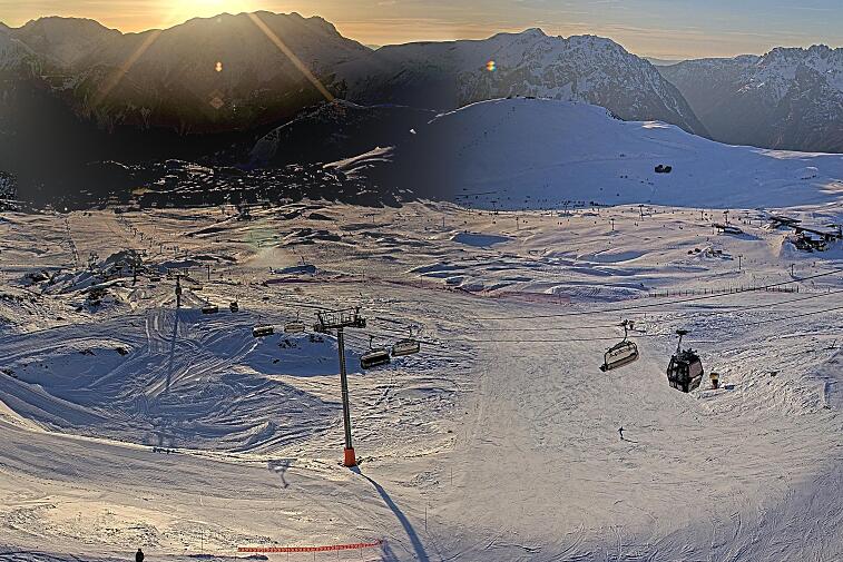 A black and white photo of a ski lift in the mountains