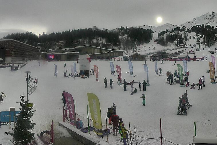 An aerial view of a snowy landscape with a time stamp of 00:23:05