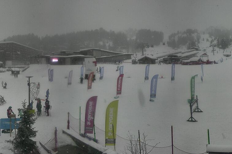 An aerial view of a snowy landscape with a time stamp of 00:23:05