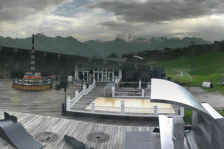 A picture of a snowy mountain taken by a webcam