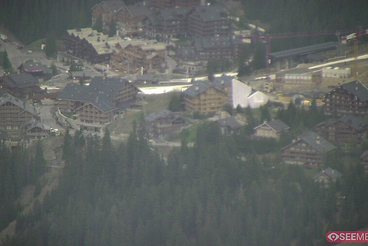 Webcam view showing the meeting point of several ski runs into Meribel, and part of the upper reaches of the resort