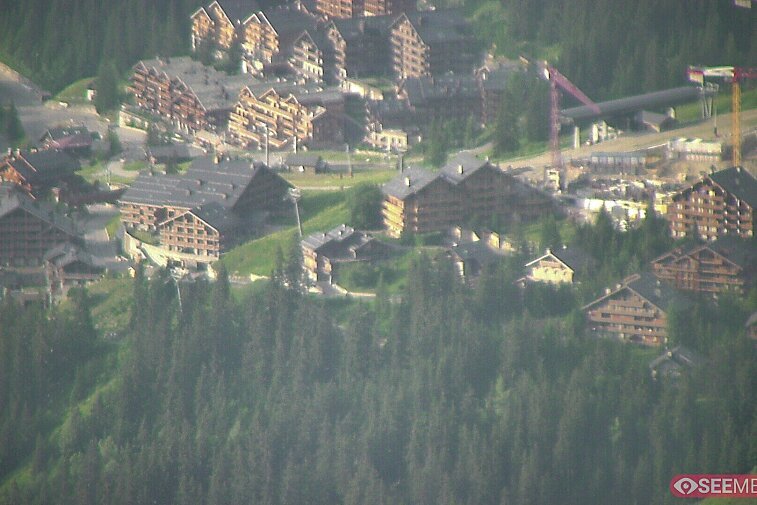 Webcam view showing the meeting point of several ski runs into Meribel, and part of the upper reaches of the resort
