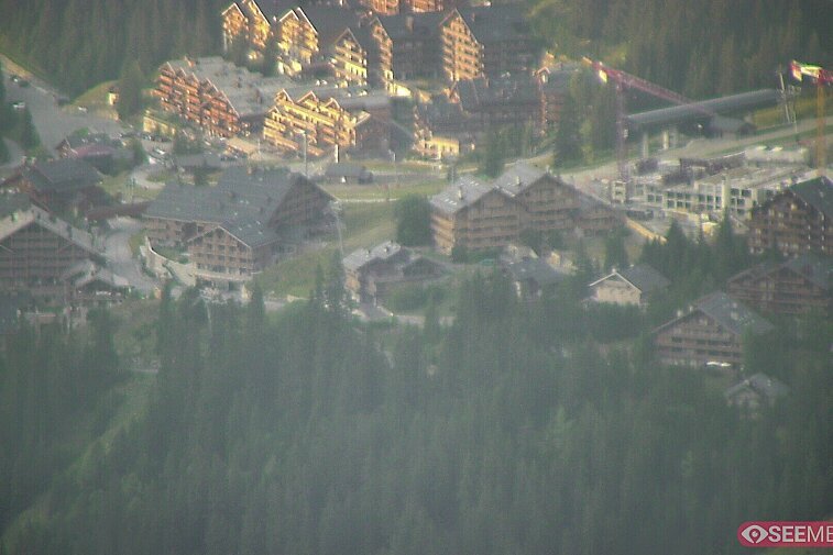 Webcam view showing the meeting point of several ski runs into Meribel, and part of the upper reaches of the resort