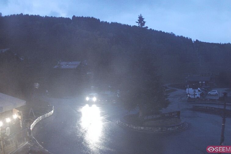 This webcam view from the entrance to Meribel Village looks out over the pistes coming down to the village