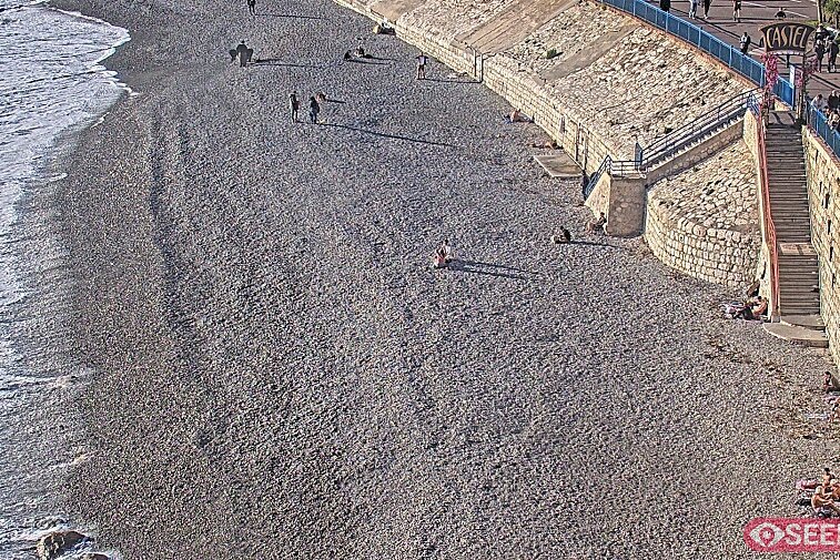 Webcam view of the Castel beach and club on the eastern-most side of the Promenade des Anglais and nestled under the Parc du Chateau, in Nice, France