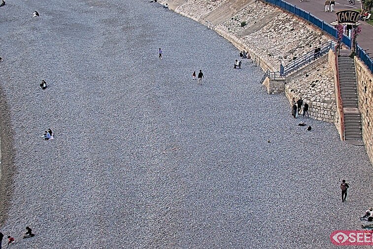 Webcam view of the Castel beach and club on the eastern-most side of the Promenade des Anglais and nestled under the Parc du Chateau, in Nice, France