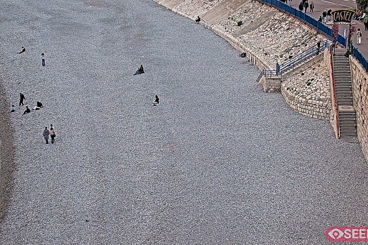 Webcam view of the Castel beach and club on the eastern-most side of the Promenade des Anglais and nestled under the Parc du Chateau, in Nice, France