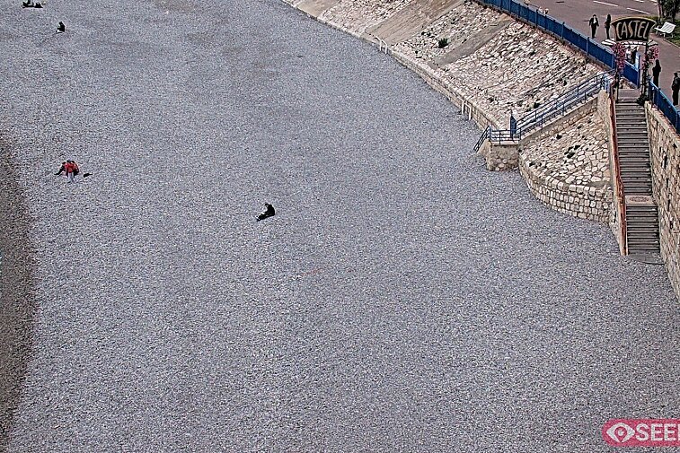 Webcam view of the Castel beach and club on the eastern-most side of the Promenade des Anglais and nestled under the Parc du Chateau, in Nice, France