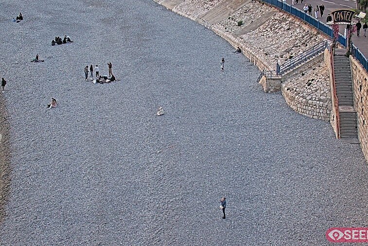 Webcam view of the Castel beach and club on the eastern-most side of the Promenade des Anglais and nestled under the Parc du Chateau, in Nice, France