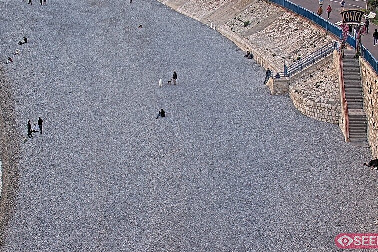 Webcam view of the Castel beach and club on the eastern-most side of the Promenade des Anglais and nestled under the Parc du Chateau, in Nice, France