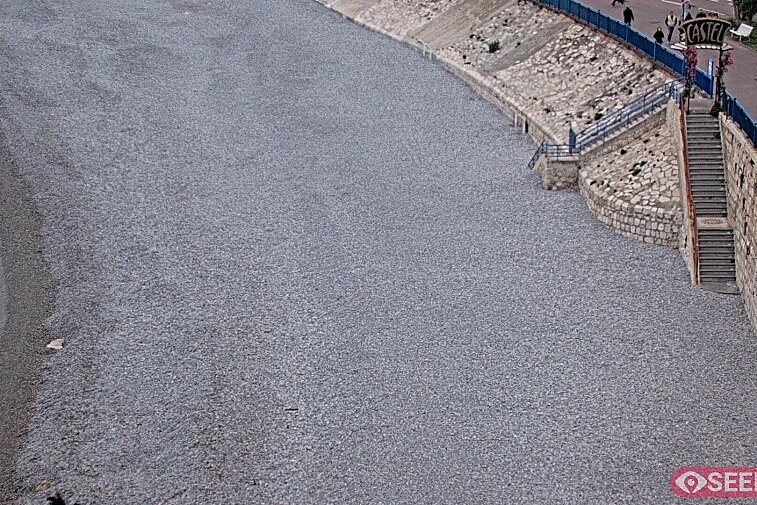 Webcam view of the Castel beach and club on the eastern-most side of the Promenade des Anglais and nestled under the Parc du Chateau, in Nice, France