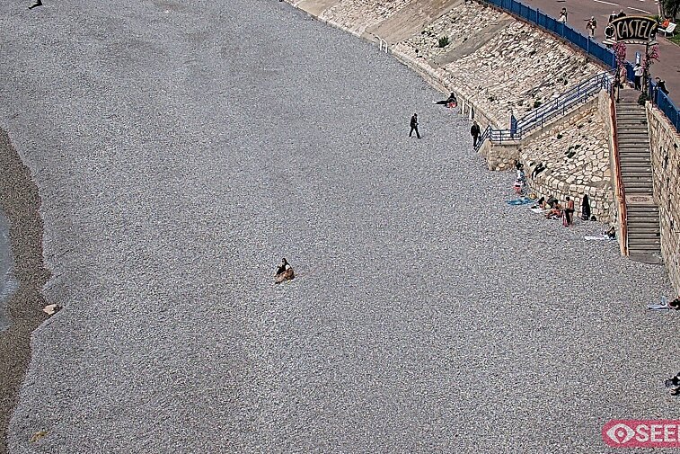 Webcam view of the Castel beach and club on the eastern-most side of the Promenade des Anglais and nestled under the Parc du Chateau, in Nice, France