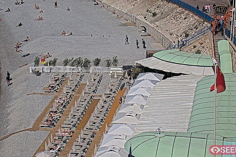 Webcam view of the Castel beach and club on the eastern-most side of the Promenade des Anglais and nestled under the Parc du Chateau, in Nice, France