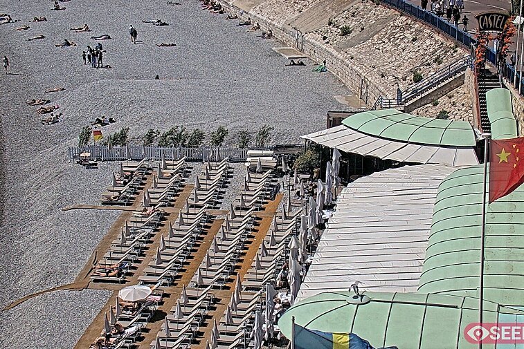 Webcam view of the Castel beach and club on the eastern-most side of the Promenade des Anglais and nestled under the Parc du Chateau, in Nice, France