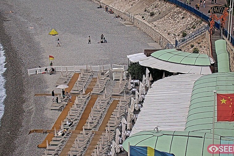 Webcam view of the Castel beach and club on the eastern-most side of the Promenade des Anglais and nestled under the Parc du Chateau, in Nice, France