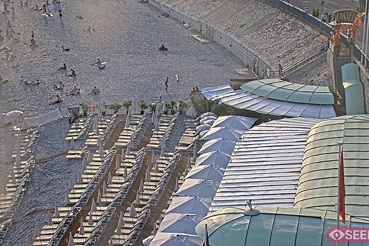 Webcam view of the Castel beach and club on the eastern-most side of the Promenade des Anglais and nestled under the Parc du Chateau, in Nice, France