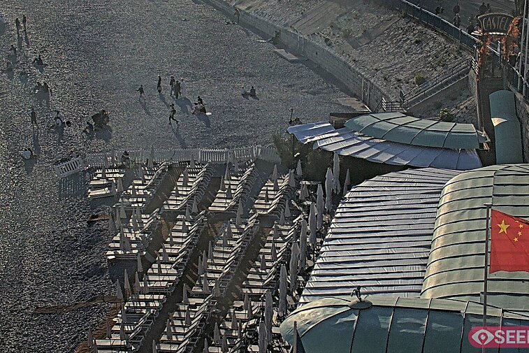 Webcam view of the Castel beach and club on the eastern-most side of the Promenade des Anglais and nestled under the Parc du Chateau, in Nice, France