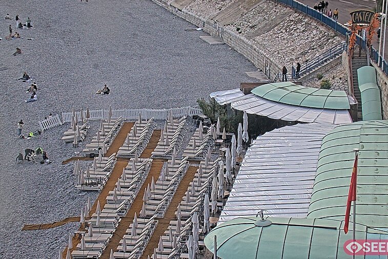Webcam view of the Castel beach and club on the eastern-most side of the Promenade des Anglais and nestled under the Parc du Chateau, in Nice, France