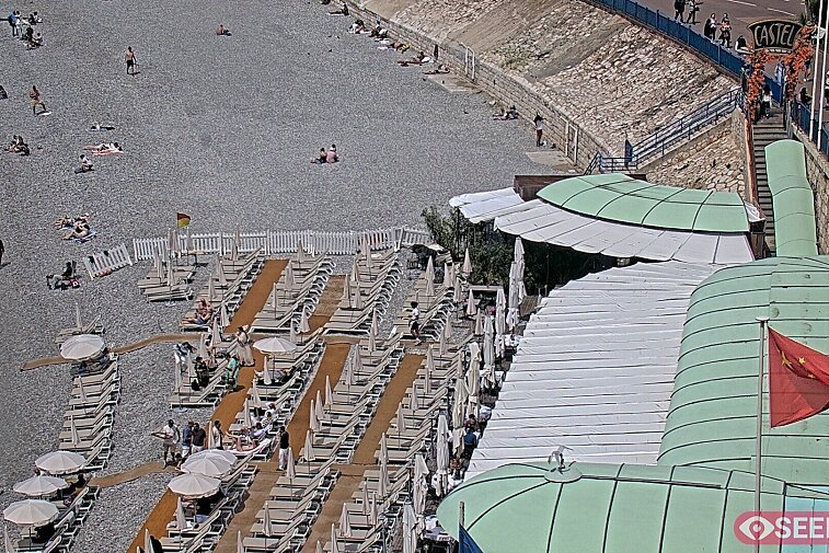 Webcam view of the Castel beach and club on the eastern-most side of the Promenade des Anglais and nestled under the Parc du Chateau, in Nice, France