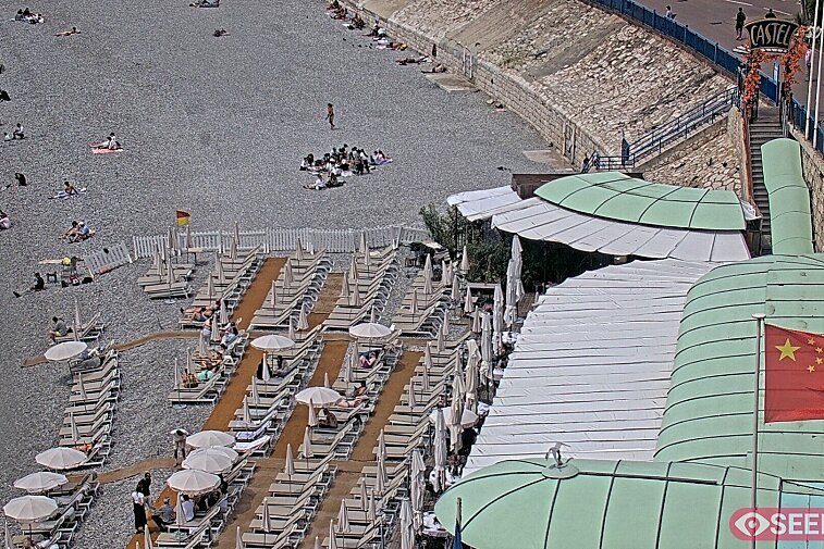 Webcam view of the Castel beach and club on the eastern-most side of the Promenade des Anglais and nestled under the Parc du Chateau, in Nice, France