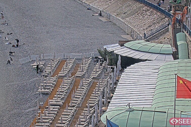 Webcam view of the Castel beach and club on the eastern-most side of the Promenade des Anglais and nestled under the Parc du Chateau, in Nice, France