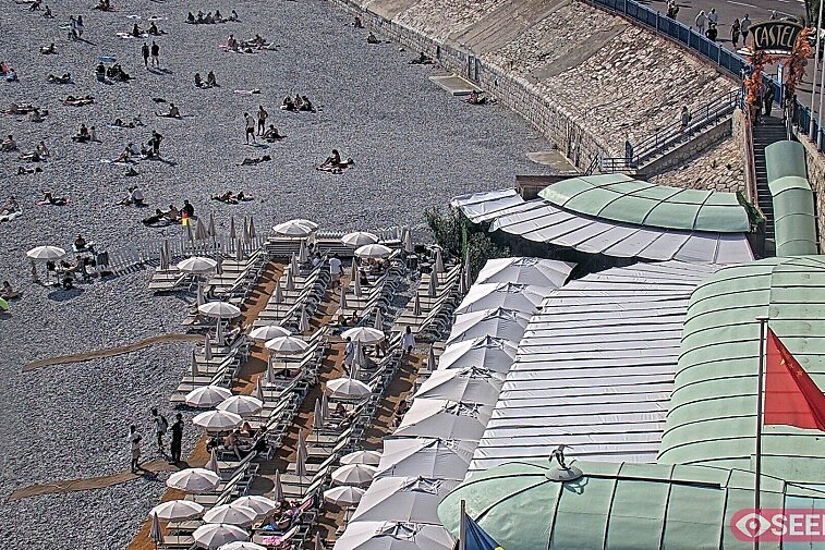 Webcam view of the Castel beach and club on the eastern-most side of the Promenade des Anglais and nestled under the Parc du Chateau, in Nice, France