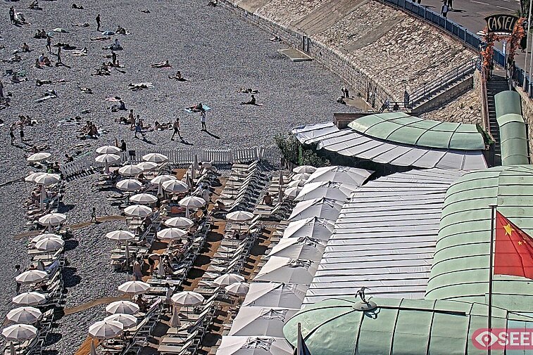 Webcam view of the Castel beach and club on the eastern-most side of the Promenade des Anglais and nestled under the Parc du Chateau, in Nice, France