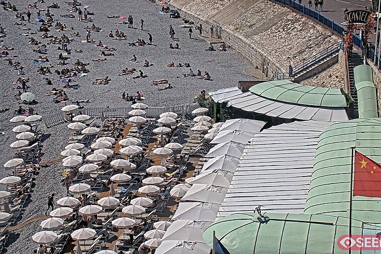 Webcam view of the Castel beach and club on the eastern-most side of the Promenade des Anglais and nestled under the Parc du Chateau, in Nice, France