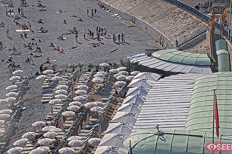 Webcam view of the Castel beach and club on the eastern-most side of the Promenade des Anglais and nestled under the Parc du Chateau, in Nice, France