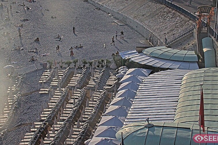 Webcam view of the Castel beach and club on the eastern-most side of the Promenade des Anglais and nestled under the Parc du Chateau, in Nice, France