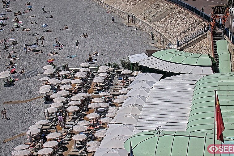 Webcam view of the Castel beach and club on the eastern-most side of the Promenade des Anglais and nestled under the Parc du Chateau, in Nice, France