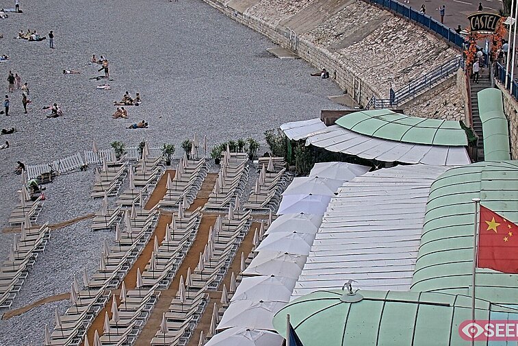 Webcam view of the Castel beach and club on the eastern-most side of the Promenade des Anglais and nestled under the Parc du Chateau, in Nice, France