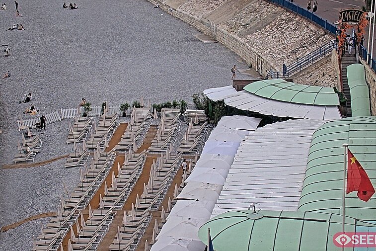 Webcam view of the Castel beach and club on the eastern-most side of the Promenade des Anglais and nestled under the Parc du Chateau, in Nice, France