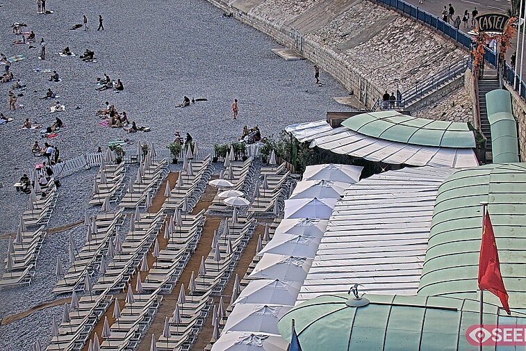 Webcam view of the Castel beach and club on the eastern-most side of the Promenade des Anglais and nestled under the Parc du Chateau, in Nice, France