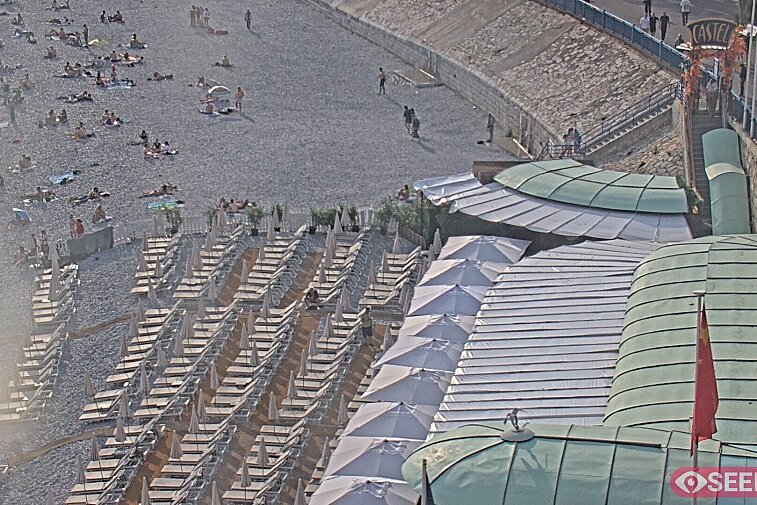 Webcam view of the Castel beach and club on the eastern-most side of the Promenade des Anglais and nestled under the Parc du Chateau, in Nice, France
