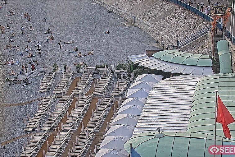 Webcam view of the Castel beach and club on the eastern-most side of the Promenade des Anglais and nestled under the Parc du Chateau, in Nice, France