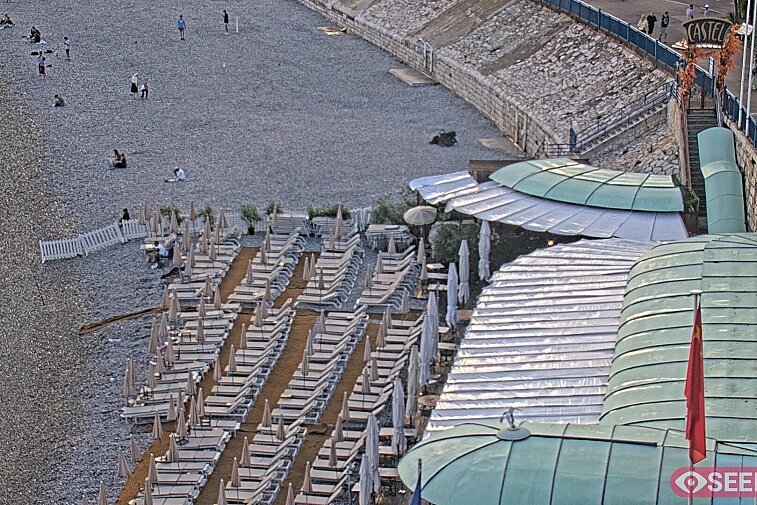 Webcam view of the Castel beach and club on the eastern-most side of the Promenade des Anglais and nestled under the Parc du Chateau, in Nice, France