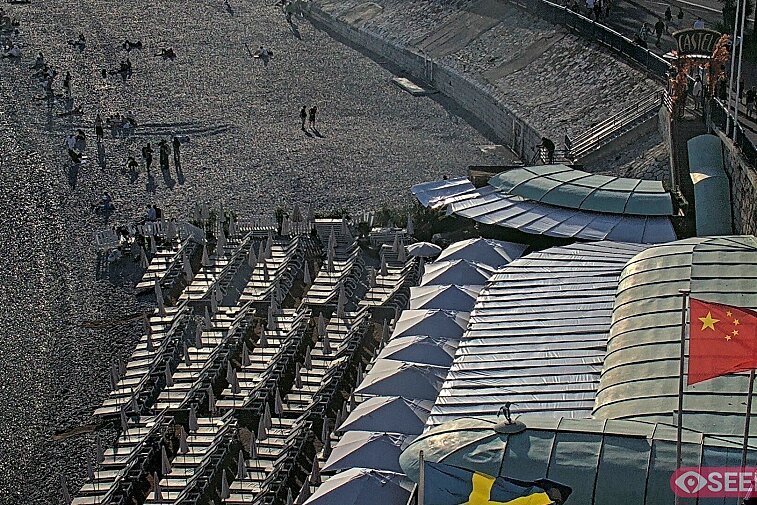 Webcam view of the Castel beach and club on the eastern-most side of the Promenade des Anglais and nestled under the Parc du Chateau, in Nice, France