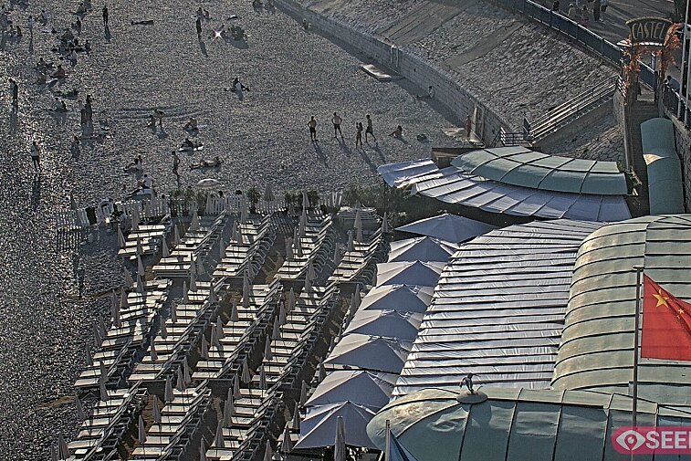Webcam view of the Castel beach and club on the eastern-most side of the Promenade des Anglais and nestled under the Parc du Chateau, in Nice, France