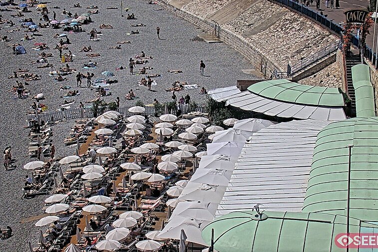 Webcam view of the Castel beach and club on the eastern-most side of the Promenade des Anglais and nestled under the Parc du Chateau, in Nice, France