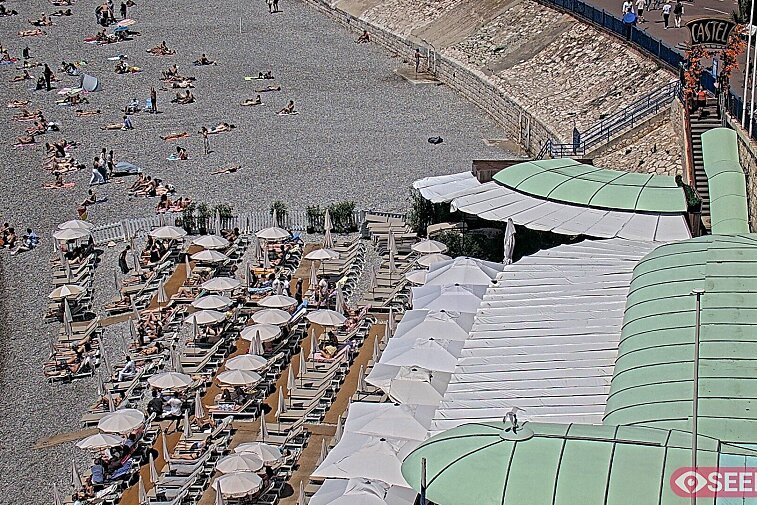 Webcam view of the Castel beach and club on the eastern-most side of the Promenade des Anglais and nestled under the Parc du Chateau, in Nice, France