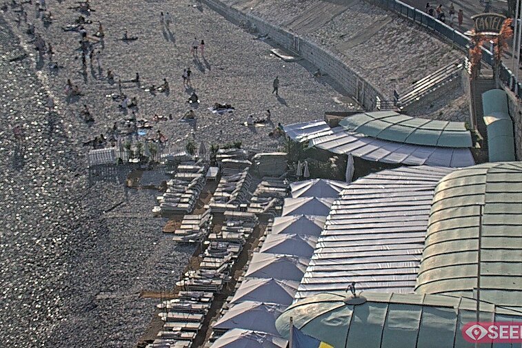 Webcam view of the Castel beach and club on the eastern-most side of the Promenade des Anglais and nestled under the Parc du Chateau, in Nice, France