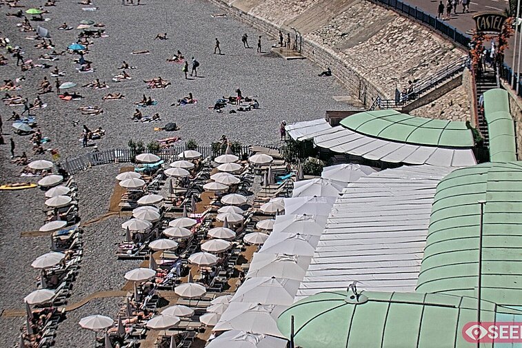 Webcam view of the Castel beach and club on the eastern-most side of the Promenade des Anglais and nestled under the Parc du Chateau, in Nice, France