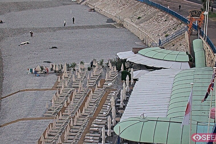 Webcam view of the Castel beach and club on the eastern-most side of the Promenade des Anglais and nestled under the Parc du Chateau, in Nice, France