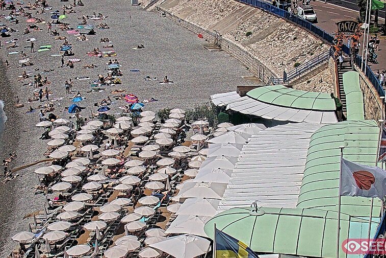 Webcam view of the Castel beach and club on the eastern-most side of the Promenade des Anglais and nestled under the Parc du Chateau, in Nice, France