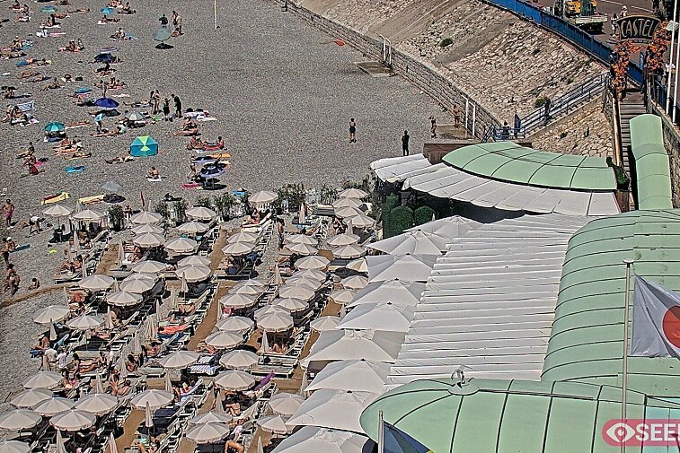 Webcam view of the Castel beach and club on the eastern-most side of the Promenade des Anglais and nestled under the Parc du Chateau, in Nice, France